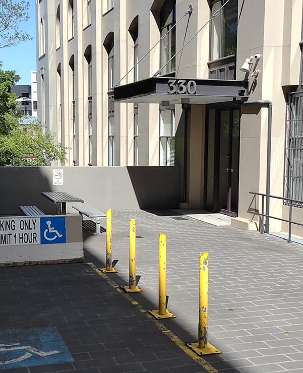 A building with a sign and a bench

AI-generated content may be incorrect.